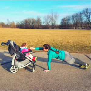 For this exercise, you get to move to the front. Place your hands on the ground shoulder width apart and walk your feet back into a plank position. Be sure to stay within reach of the stroller. Carefully lift one hand at a time. If your little one is awake, you can reach up and tickle them or exchange high fives. Reach up a total of 20 times before moving on.